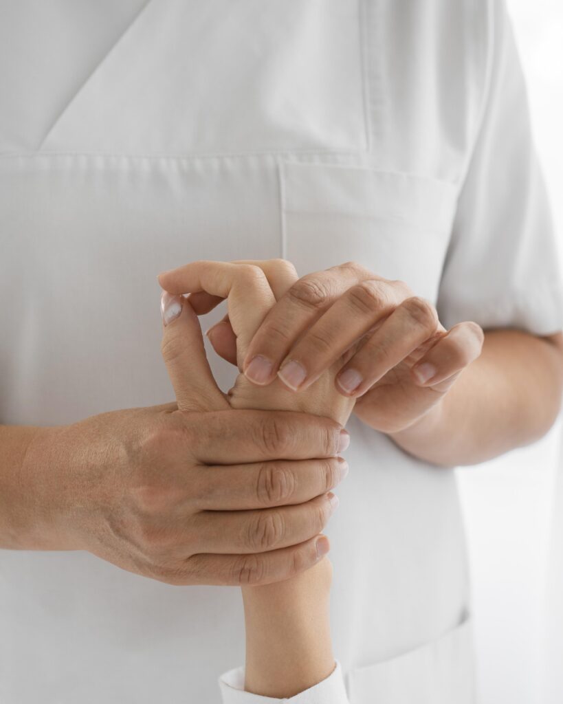 osteopathist treating patient s arms